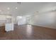 Open concept living room with wood-look floors and kitchen island view at 34690 N Ashwood Dr, San Tan Valley, AZ 85144