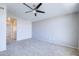 Bright bedroom featuring a ceiling fan and neutral carpet, ready for personalization at 3591 S Larkspur Way, Chandler, AZ 85248