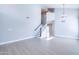 Bright and airy living room featuring vinyl floors and a staircase with a black handrail at 3591 S Larkspur Way, Chandler, AZ 85248