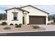 One-story home with brown garage door and desert landscaping at 47476 W Kenner Dr, Maricopa, AZ 85139