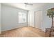 Bright bedroom features a ceiling fan, closet, wood floors, and lots of natural light at 5373 W Dublin Ct, Chandler, AZ 85226