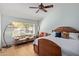 Light-filled bedroom with a ceiling fan, natural light, and hardwood flooring at 5373 W Dublin Ct, Chandler, AZ 85226