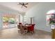 Light-filled dining room featuring high ceilings, tile flooring, and sliding door access to the patio at 5373 W Dublin Ct, Chandler, AZ 85226