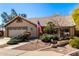 Inviting home with a tile roof, an American flag, and a well-maintained front yard at 5373 W Dublin Ct, Chandler, AZ 85226