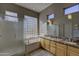 Bathroom with double vanity, granite countertop, and glass shower at 6788 E Nightingale Star Cir, Scottsdale, AZ 85266