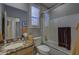 Bathroom with granite vanity, shower/tub combo, and window at 6788 E Nightingale Star Cir, Scottsdale, AZ 85266