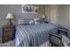 King-size bedroom with striped bedding and southwestern decor at 6788 E Nightingale Star Cir, Scottsdale, AZ 85266