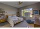 Main bedroom with large window, ceiling fan, and ample space at 6788 E Nightingale Star Cir, Scottsdale, AZ 85266