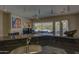 Kitchen island with breakfast bar, sink, and view of backyard at 6788 E Nightingale Star Cir, Scottsdale, AZ 85266