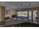 Kitchen with a breakfast bar overlooking the living room and pool at 6788 E Nightingale Star Cir, Scottsdale, AZ 85266