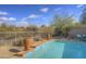 Inviting pool with spa and desert landscape at 6788 E Nightingale Star Cir, Scottsdale, AZ 85266