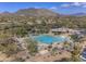 Community swimming pool with surrounding lounge chairs at 6788 E Nightingale Star Cir, Scottsdale, AZ 85266