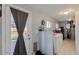 Laundry room featuring a door to the backyard, a window, and washer and dryer at 7018 E Wilshire Dr, Scottsdale, AZ 85257