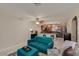 Open concept living room with tile floors and comfortable seating, connected to a kitchen with stainless steel appliances at 7018 E Wilshire Dr, Scottsdale, AZ 85257