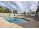 A refreshing backyard pool surrounded by lush landscaping, patio space, and privacy fencing at 7018 E Wilshire Dr, Scottsdale, AZ 85257