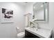 Clean and contemporary half bathroom with a floating vanity at 7710 E Gainey Ranch Rd # 152, Scottsdale, AZ 85258