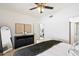 Bedroom with window, ceiling fan and built-in storage at 7710 E Gainey Ranch Rd # 152, Scottsdale, AZ 85258