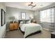 Guest bedroom with light green bedding and neutral decor at 8030 E Palm Ln, Mesa, AZ 85212