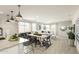 Open concept dining area with large wooden table and seating at 8030 E Palm Ln, Mesa, AZ 85212