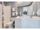 Modern bathroom with double sinks, white cabinets and a walk-in shower at 8149 E Petunia Ave # 1040, Mesa, AZ 85212