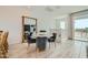 Bright dining area with marble table and gray chairs near kitchen at 8149 E Petunia Ave # 1040, Mesa, AZ 85212