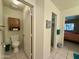 Bright bathroom featuring toilet with built in cabinet, next to walk in closet at 8260 E Keats Ave # 500, Mesa, AZ 85209