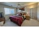 Cozy bedroom with a large window, ceiling fan, and ample natural light at 8260 E Keats Ave # 500, Mesa, AZ 85209