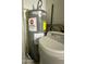 Utility room featuring water heater, water softener and broom at 8260 E Keats Ave # 500, Mesa, AZ 85209