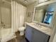 Clean bathroom, featuring a shower/tub combo, toilet and vanity with marble top at 850 S River Dr # 1002, Tempe, AZ 85281