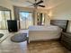 Main bedroom with large bed, mirrored closet and balcony access at 850 S River Dr # 1002, Tempe, AZ 85281