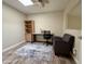 Bright home office with wood flooring, built-in shelving and comfortable seating at 850 S River Dr # 1002, Tempe, AZ 85281