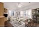 Living room with light beige sofas and wood-look flooring at 8700 E University Dr # 2216, Mesa, AZ 85207