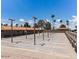 Well-lit outdoor shuffleboard courts with benches for players at 8700 E University Dr # 2216, Mesa, AZ 85207