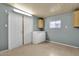 Bright storage room with double doors and overhead cabinets at 8700 E University Dr # 2216, Mesa, AZ 85207