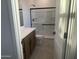 Bathroom with walk-in shower and updated vanity at 9221 E Sector Dr, Mesa, AZ 85212