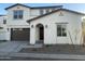 Two-story home with attached garage and landscaping at 9221 E Sector Dr, Mesa, AZ 85212