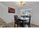 Dining area features a modern table set next to a window offering natural light and outside views at 924 S Evergreen St, Chandler, AZ 85225