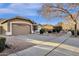 This single story home has a two car garage and a well maintained desert landscape at 924 S Evergreen St, Chandler, AZ 85225