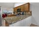 Kitchen featuring granite countertops, stainless steel appliances, and wood cabinetry at 924 S Evergreen St, Chandler, AZ 85225