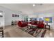 This living room is spacious with modern furnishings, tile floors, and neutral wall color at 924 S Evergreen St, Chandler, AZ 85225