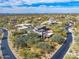 Aerial view of a sprawling estate with desert landscaping and neighborhood views at 9290 E Thompson Peak Pkwy # 444, Scottsdale, AZ 85255