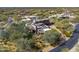 A gorgeous aerial view of a southwest home with beautiful desert landscaping at 9290 E Thompson Peak Pkwy # 444, Scottsdale, AZ 85255