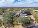 A gorgeous aerial view of an estate with beautiful desert landscaping at 9290 E Thompson Peak Pkwy # 444, Scottsdale, AZ 85255