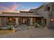 Charming home showcasing a tile roof, wrought iron accents, and a tranquil water feature enhancing the entrance at 9290 E Thompson Peak Pkwy # 444, Scottsdale, AZ 85255