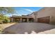 Home exterior showcasing a desert landscaped front yard, barrel tile roof and two-car garage at 9290 E Thompson Peak Pkwy # 444, Scottsdale, AZ 85255