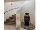 Elegant staircase featuring decorative tile risers and wrought iron railing at 9290 E Thompson Peak Pkwy # 444, Scottsdale, AZ 85255