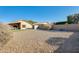 Backyard view showing gravel, shed, and block wall at 9477 W Frank Ave, Peoria, AZ 85382