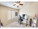 Bedroom with window, ceiling fan, and built in desk area at 9477 W Frank Ave, Peoria, AZ 85382