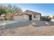 House exterior with a two-car garage and landscaping at 9477 W Frank Ave, Peoria, AZ 85382