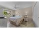 Well-lit bedroom featuring a queen-size bed and ample closet space at 9890 N Balboa Dr, Sun City, AZ 85351